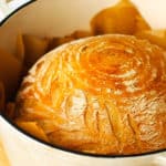 Baked Artisan Bread in a large Dutch oven pot.