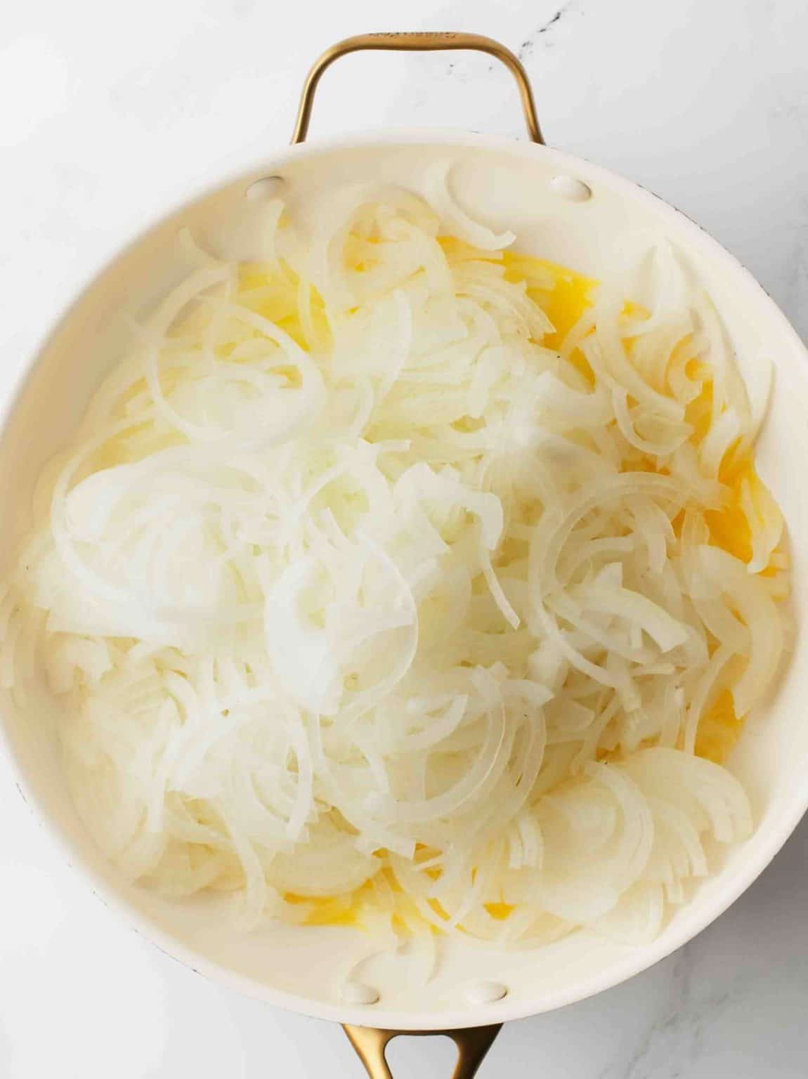 Cut onions cooking in butter and oil.