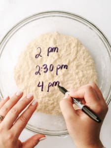 Writing on plastic wrap times for dough proofing.