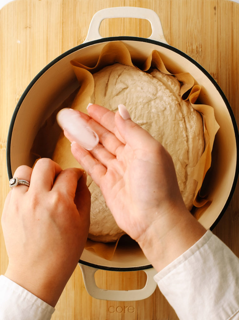 Placing ice cubes at the bottom of a Dutch oven.