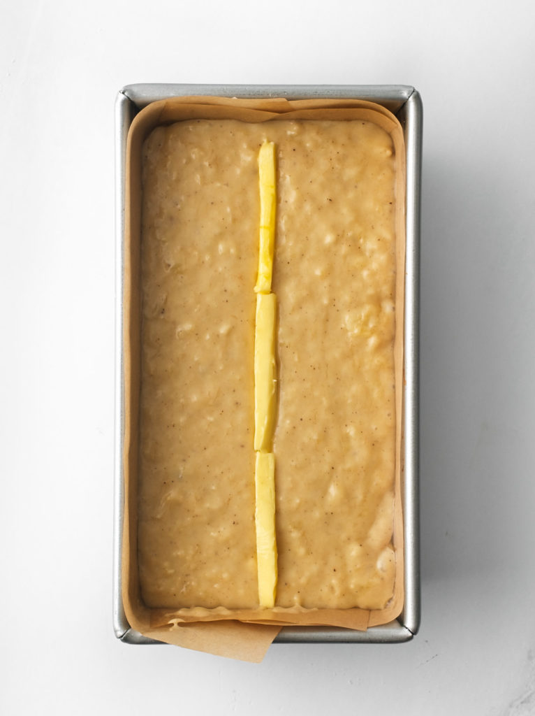 Brown spot banana bread batter in loaf tin.