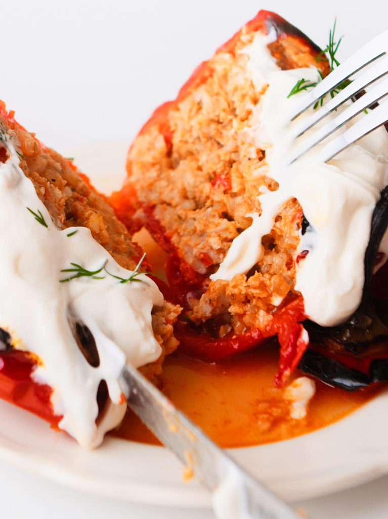 Traditional Stuffed Peppers with sour cream and fresh dill.