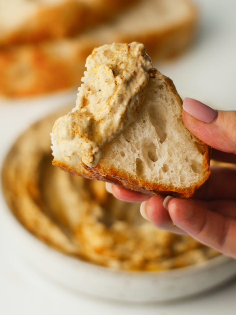 Roasted Eggplant Spread on a slice of focaccia bread.