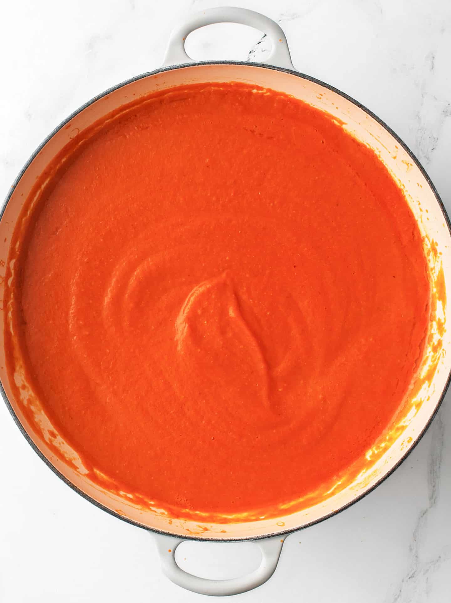 Blended pasta sauce in a large cooking pan.