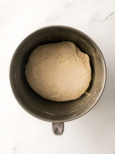 Dough ball in mixing bowl.