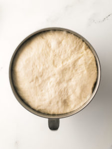 Dough ball in mixing bowl.