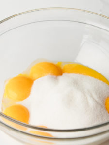 Eggs and sugar in mixing bowl.
