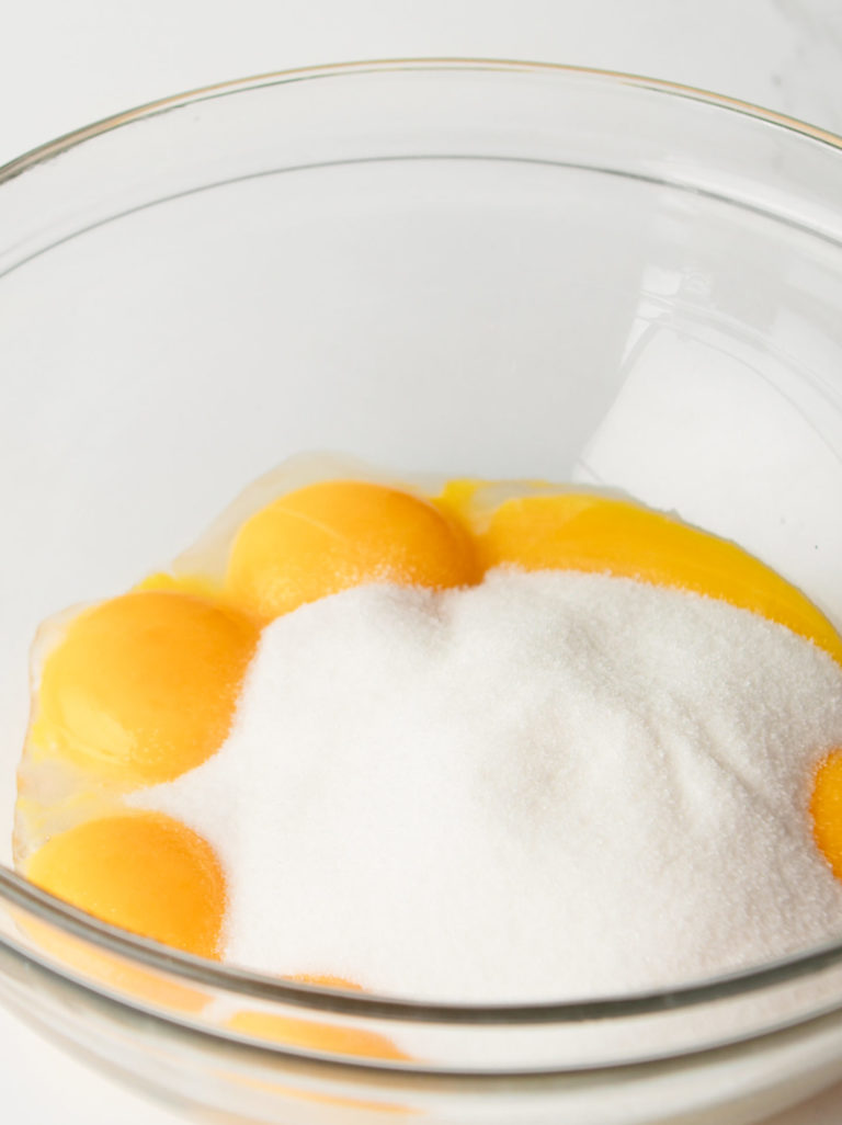 Eggs and sugar in mixing bowl.