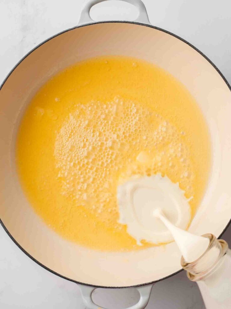 Melted butter and heavy cream in a pot.