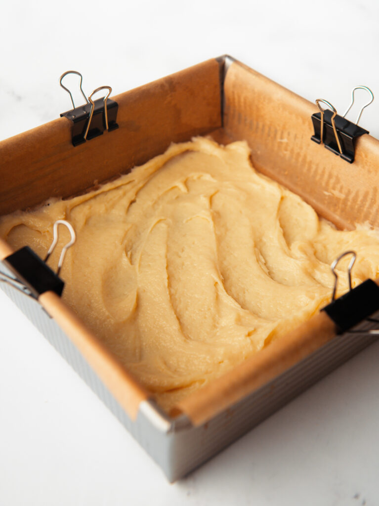 Cake batter in square pan.