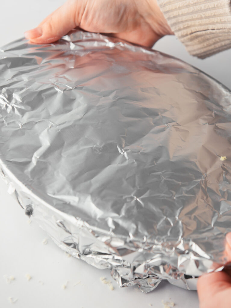 Foil covering the potatoes.