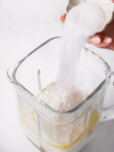 Adding sugar to blender for popover batter.