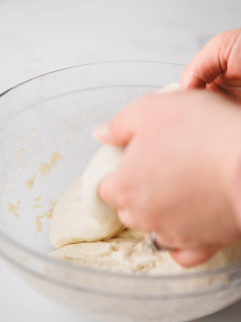 Coil method of stretching the focaccia dough.