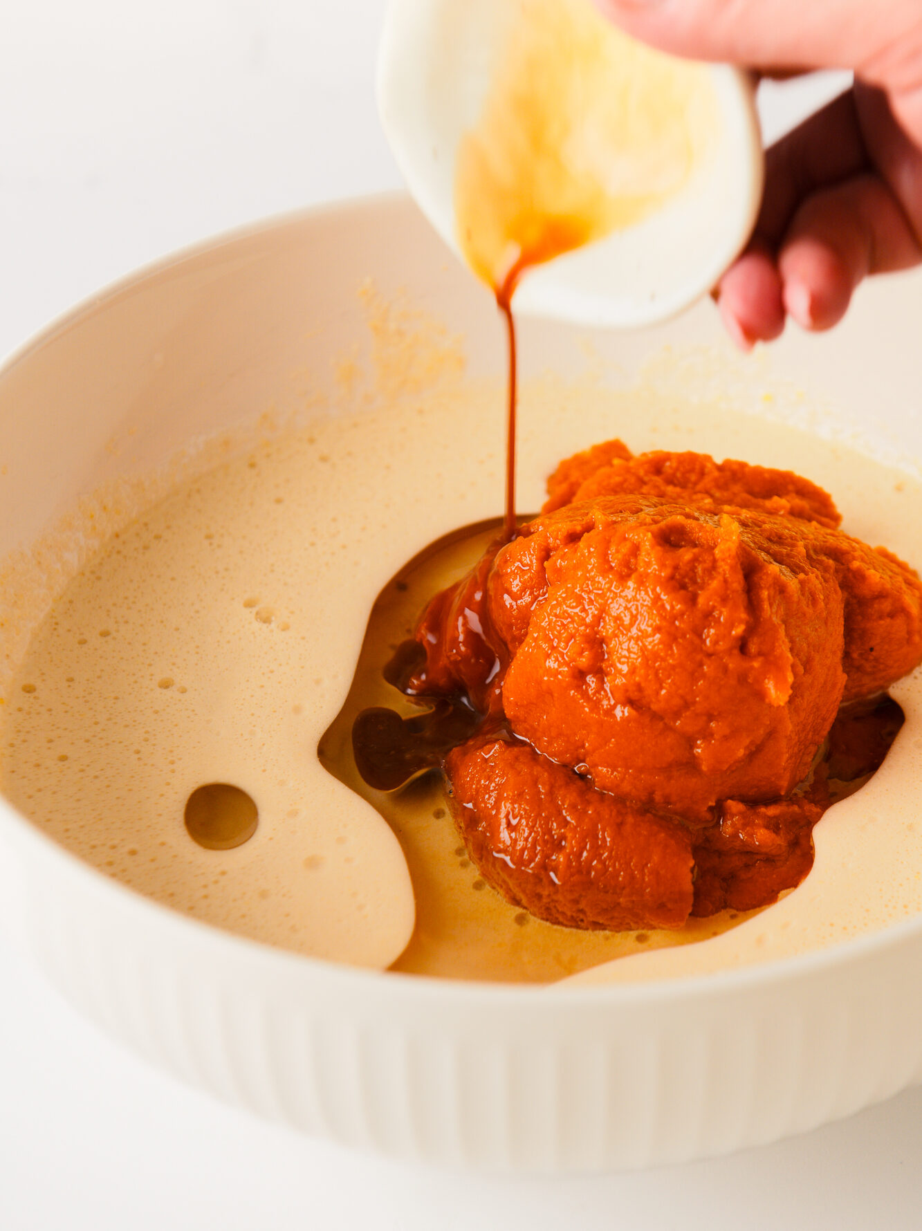 Mixing wet ingredients in large bowl.