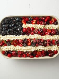 No Bake Berry Chantilly Flag Cake dusted with powdered sugar.